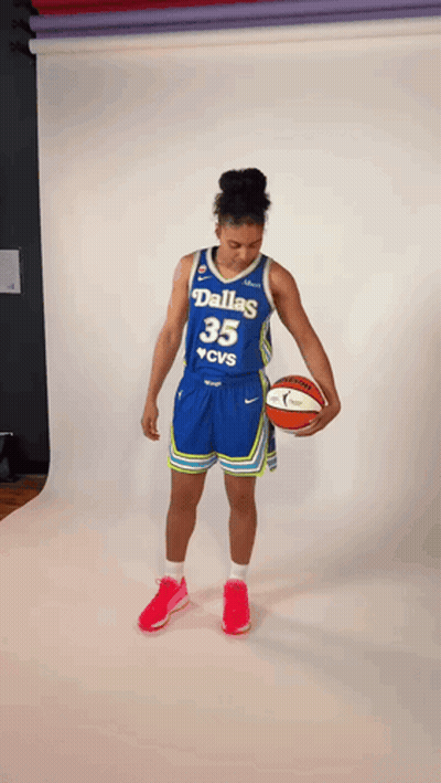 Female Basketball Player From Dallas Holding Ball GIF