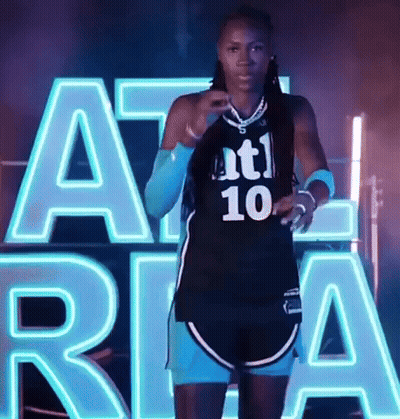 Female Basketball Player In Black Jersey Number 10 GIF