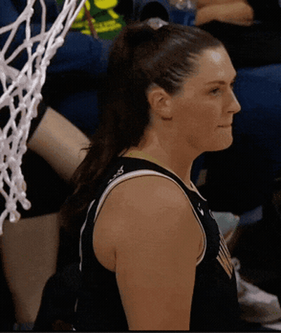 Female Basketball Player in Black Jersey With Ponytail