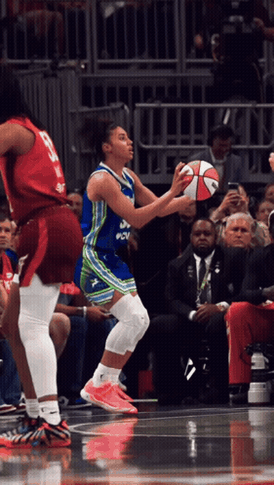 Female Basketball Player In Blue And Green PNV Uniform GIF