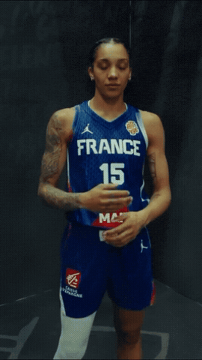 Female Basketball Player In France Jersey With Arms Crossed GIF