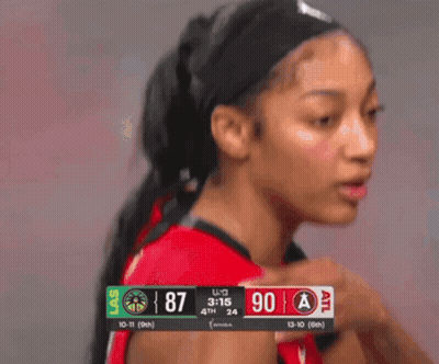 Female Basketball Player In Front Of Las Vegas Scoreboard GIF