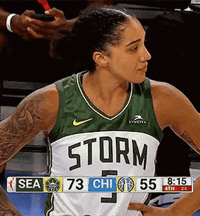 Female Basketball Player In Green And White Storm Jersey GIF