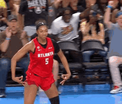 Female Basketball Player In Red Jersey Number 5 Dancing GIF