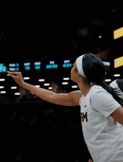Female Basketball Player In White Shirt With Letter M GIF