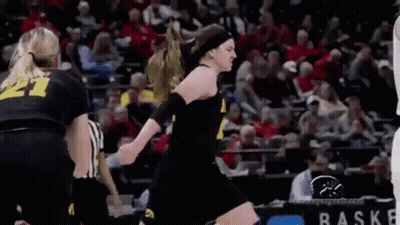 Female Basketball Player Jumping With Referee GIF