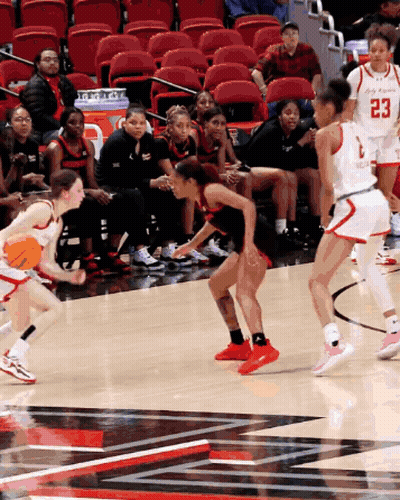 Female Basketball Player Number 23 Dribbling GIF