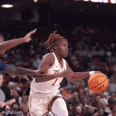Female Basketball Player Number 7 Dribbling GIF