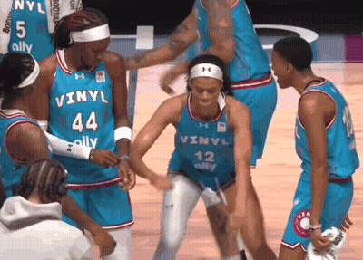Female Basketball Players In Blue Vinyl Uniforms GIF