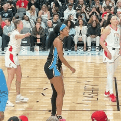 Female Basketball Players On Court With Fire On Floor GIF