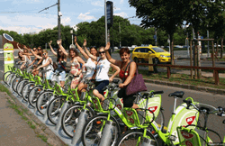 Female Bicycle Riders Synchronize Wave