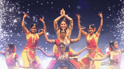 Female Dancers Performing in Front of Bharatanatyam Sign