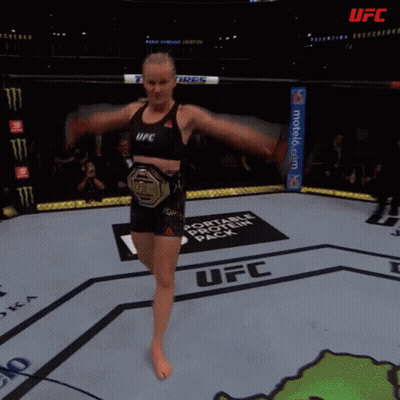 Female Fighter In UFC Ring With Toyo Tires Banner GIF