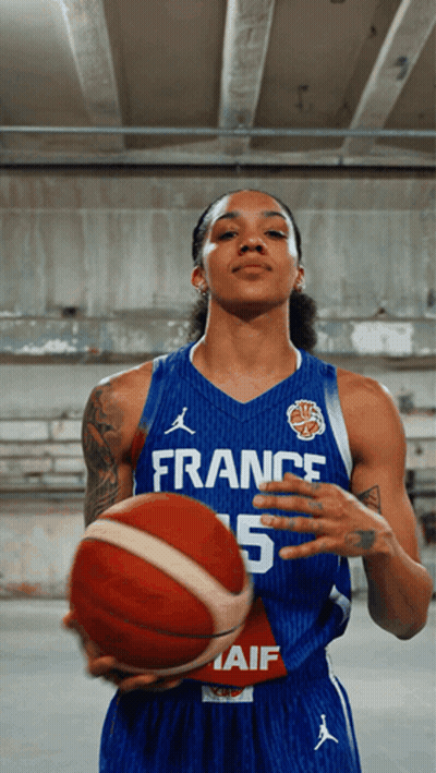 Female French Basketball Player Holding Red Basketball GIF