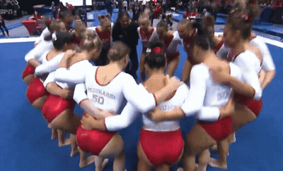 Female Gymnasts Huddled Uniform Says 50 GIF