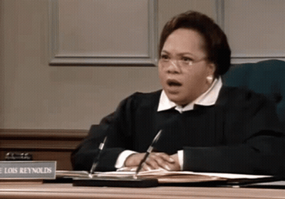Female Judge Lois Reynolds At Desk GIF