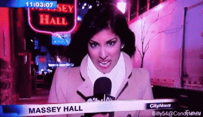 Female News Anchor Holding Microphone In Front Of Massey Hall Sign GIF
