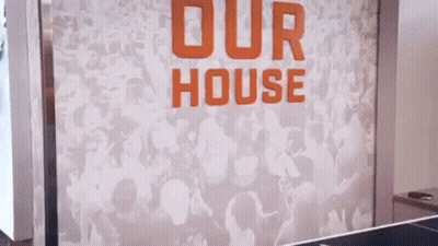 Female Referee Holding Basketball In Front Of Crowd GIF