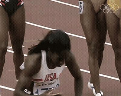 Female Runner In USA Shirt Lying On Ground GIF