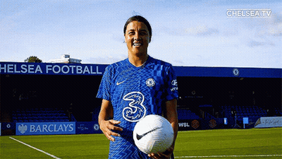 Female Soccer Player Holding Ball On Barclays Field GIF