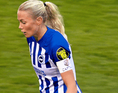 Female Soccer Player In Blue And White Striped Jersey Number 1 GIF