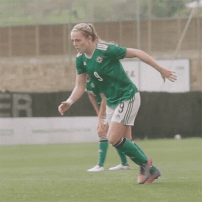 Female Soccer Player in Green Jersey Number 9