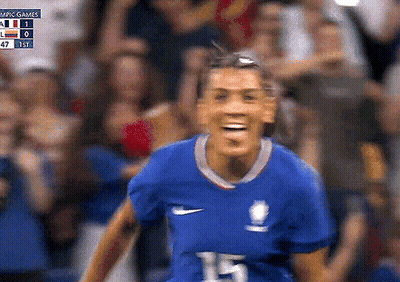 Female Soccer Player Number 15 Smiling At Crowd GIF