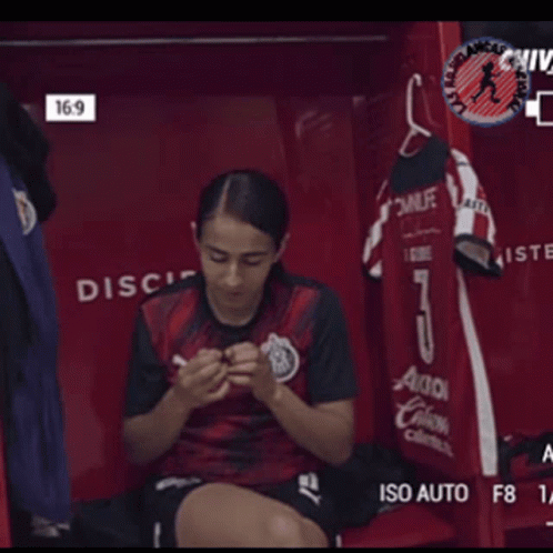 Female Soccer Player Sitting In Locker GIF