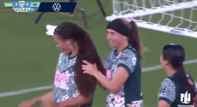 Female Soccer Players Hugging On Field GIF