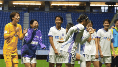 Female Soccer Players In Purple And White Uniforms Saying Edu GIF