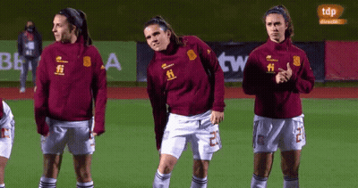 Female Soccer Players Standing With TDP In Background GIF
