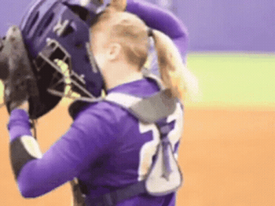 Female Softball Player In Purple Jersey Number 23 GIF