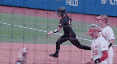 Female Softball Player Number 99 Runs To Base GIF