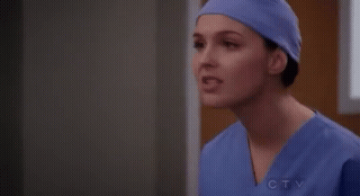 Female Surgeon In Purple Hat And Scrubs GIF