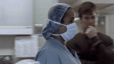 Female Surgeon in Surgical Cap and Mask