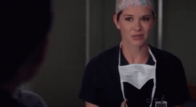 Female Surgeon Putting On Mask GIF