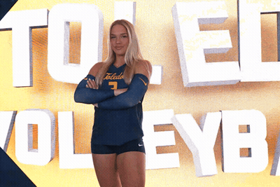 Female Volleyball Player In Front Of Toledo Sign GIF