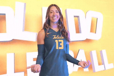Female Volleyball Player In Front Of Toledo Sign GIF