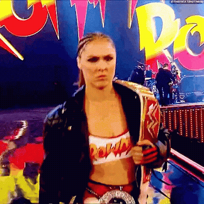 Female Wrestler Holding Championship Belt GIF