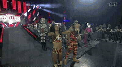 Female Wrestler Holding Championship Belt GIF