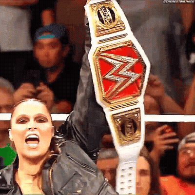 Female Wrestler Holding Championship Belt GIF