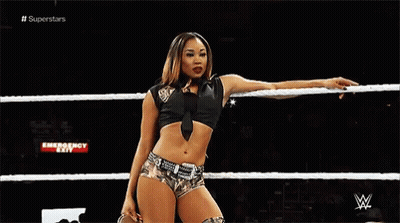 Female Wrestler Holding Rope In Wrestling Ring GIF