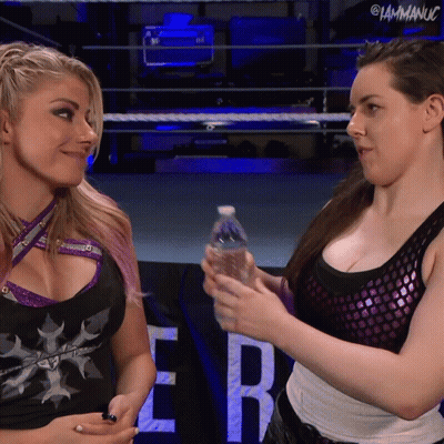 Female Wrestler Holding Water Bottle With Another Woman GIF