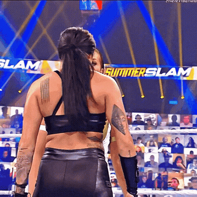 Female Wrestler In Front Of Summerslam Sign GIF