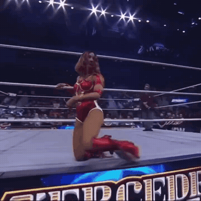 Female Wrestler Kneeling With Pride Text Behind GIF