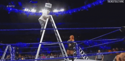 Female Wrestler Sitting On Ladder In Ring GIF