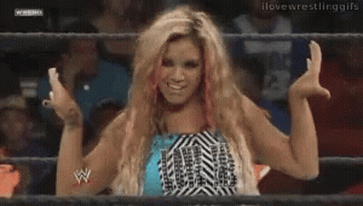 Female Wrestler Standing In Front Of NXT Screen GIF