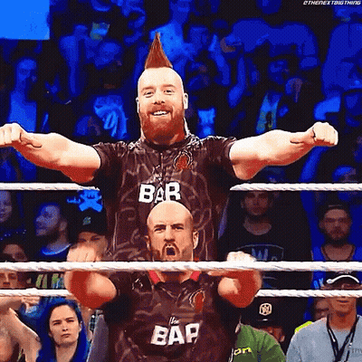 Female Wrestler Wearing Shawn Blue Shirt GIF