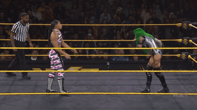 Female Wrestler With Green Hair Blowing Bubble Gum GIF