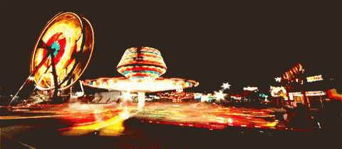 Ferris Wheel And Merry Go Round At Night GIF